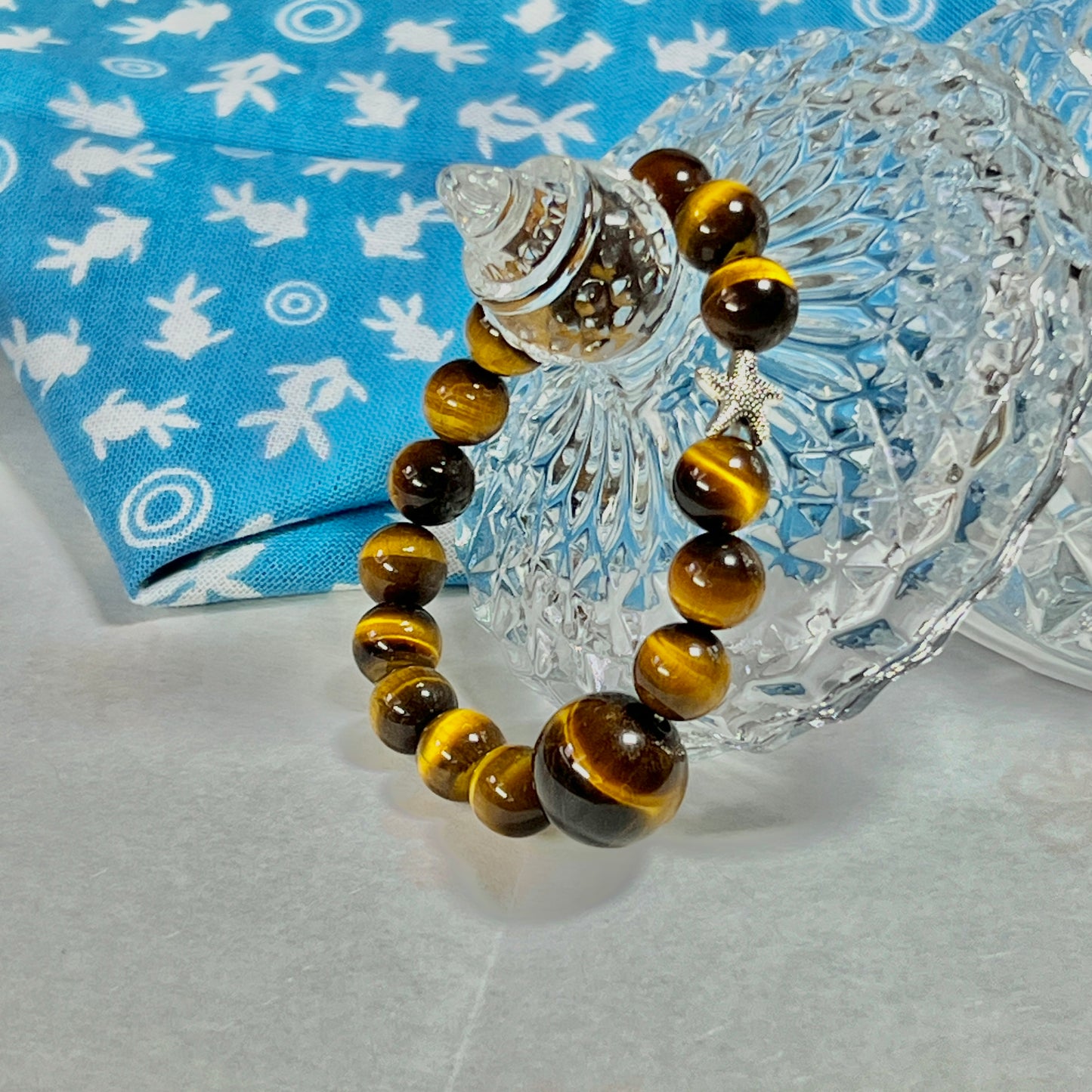 Tiger eye stone bracelet with silver starfish is lovely and lucky.