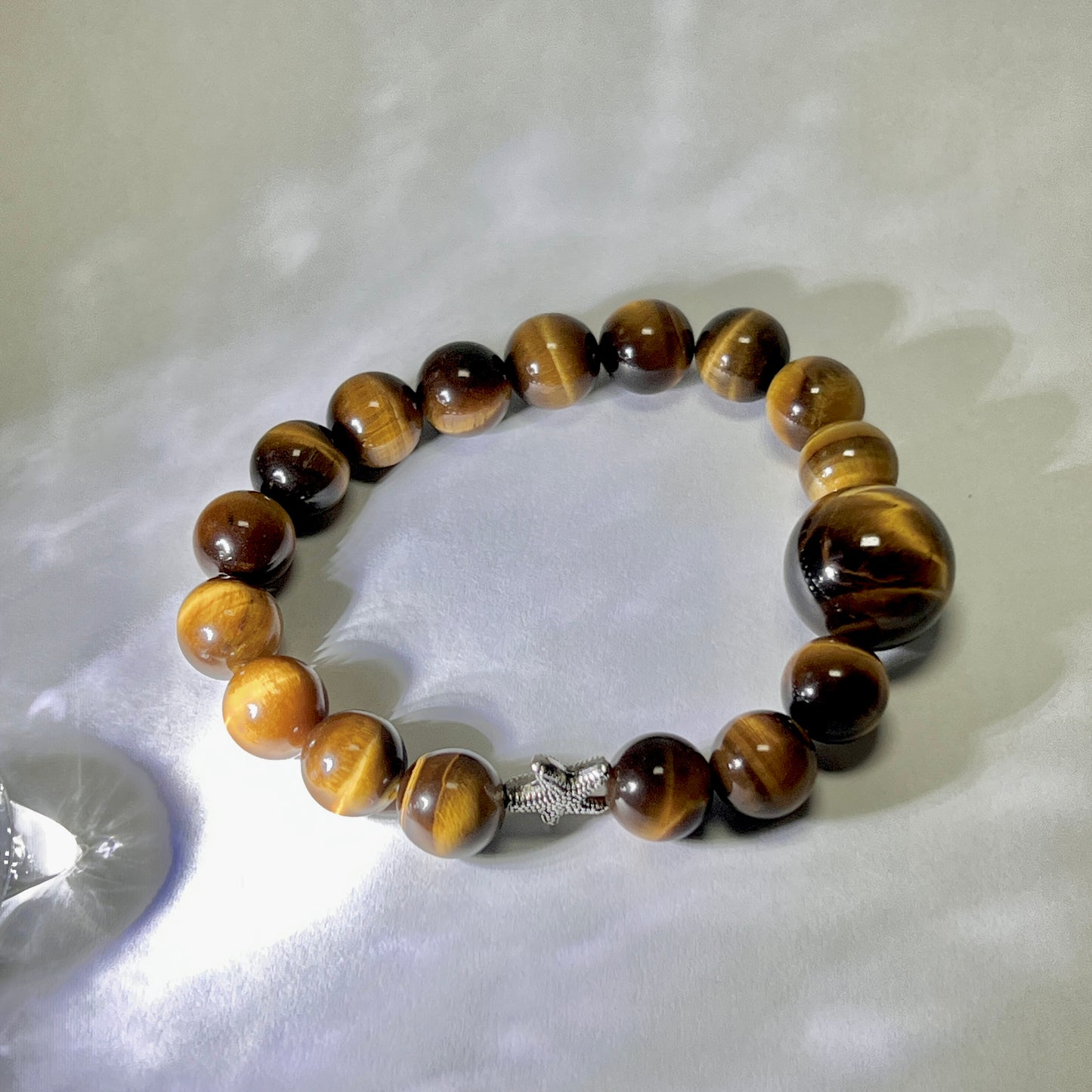 Tiger eye stone bracelet with silver starfish is lovely and lucky.