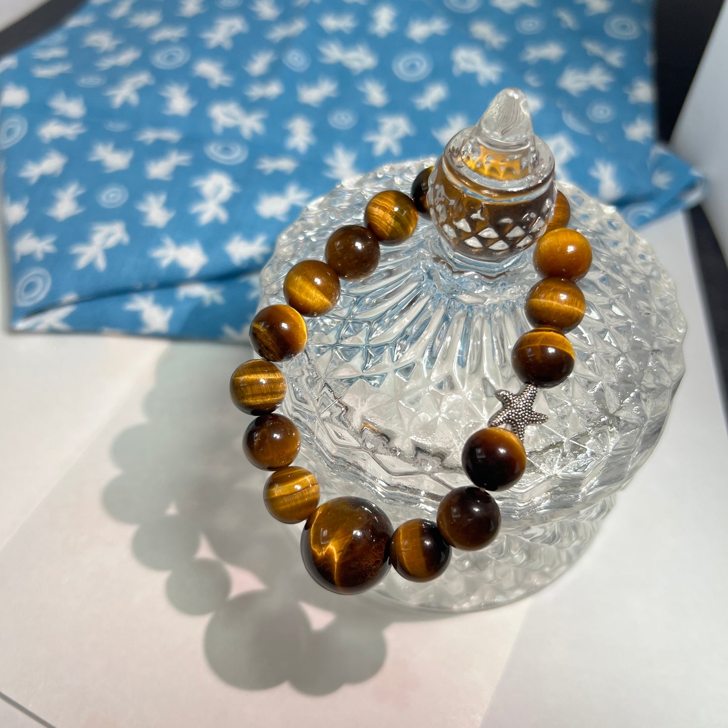 Tiger eye stone bracelet with silver starfish is lovely and lucky.