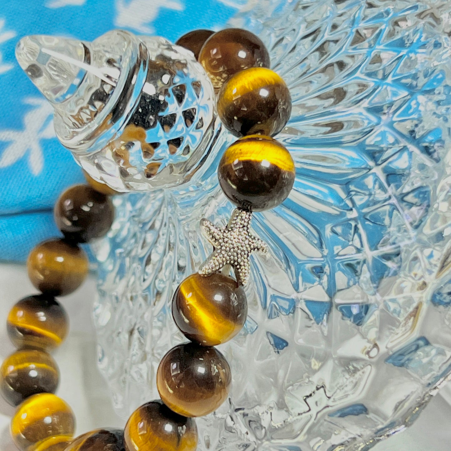 Tiger eye stone bracelet with silver starfish is lovely and lucky.