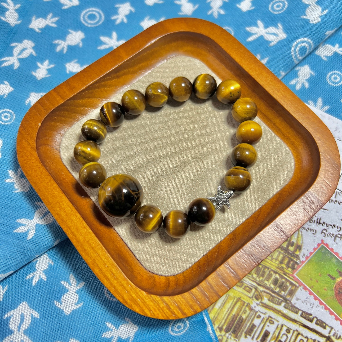 Tiger eye stone bracelet with silver starfish is lovely and lucky.